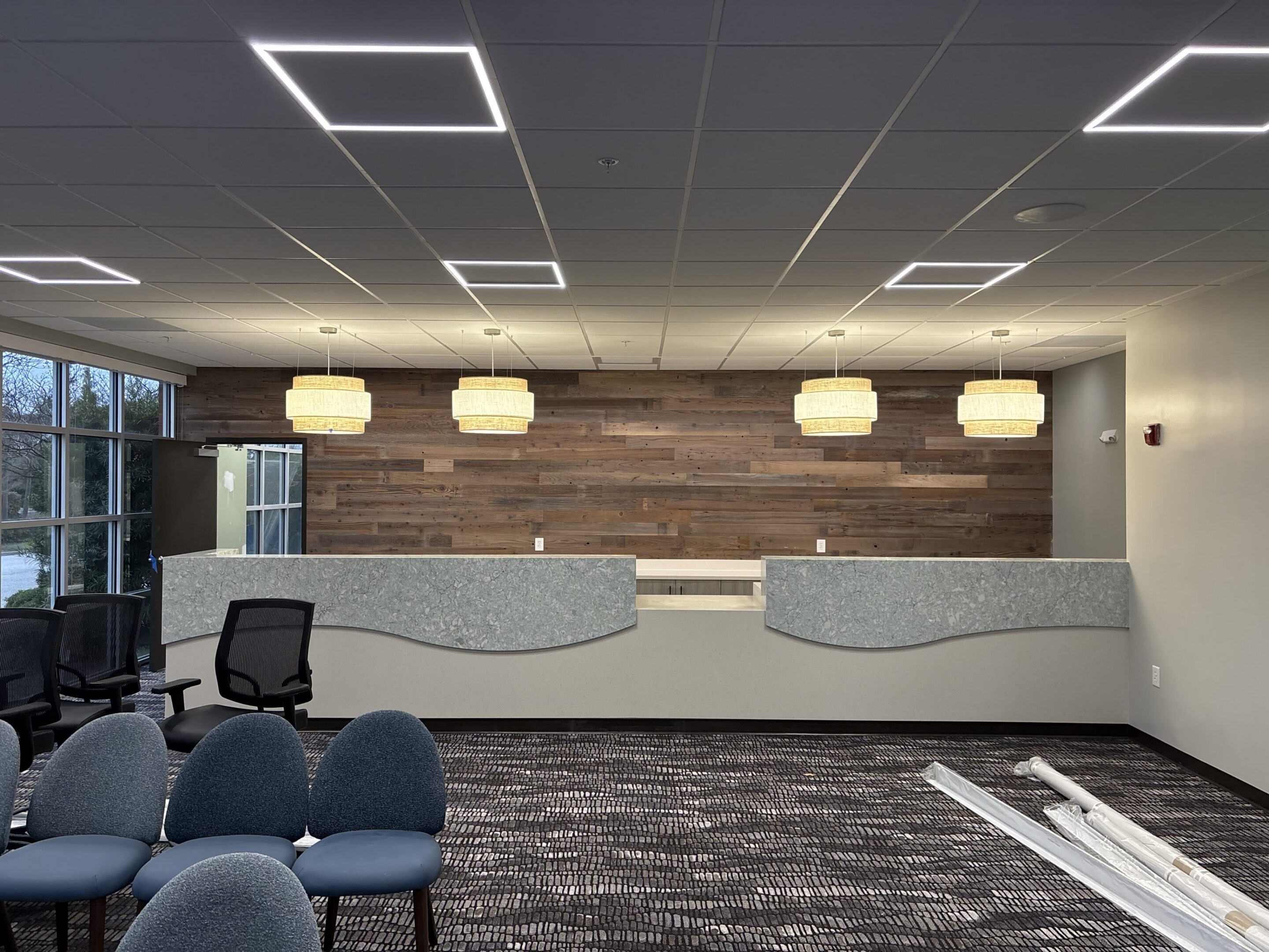 Modern office lobby with curved reception desks