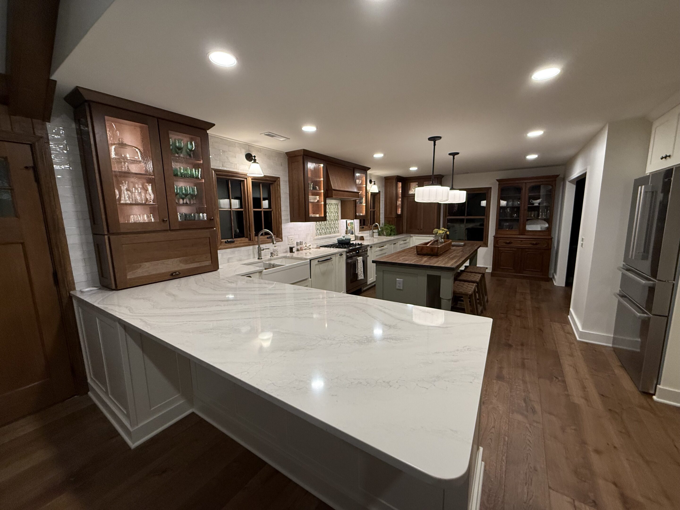 Spacious modern kitchen with island and marble countertops