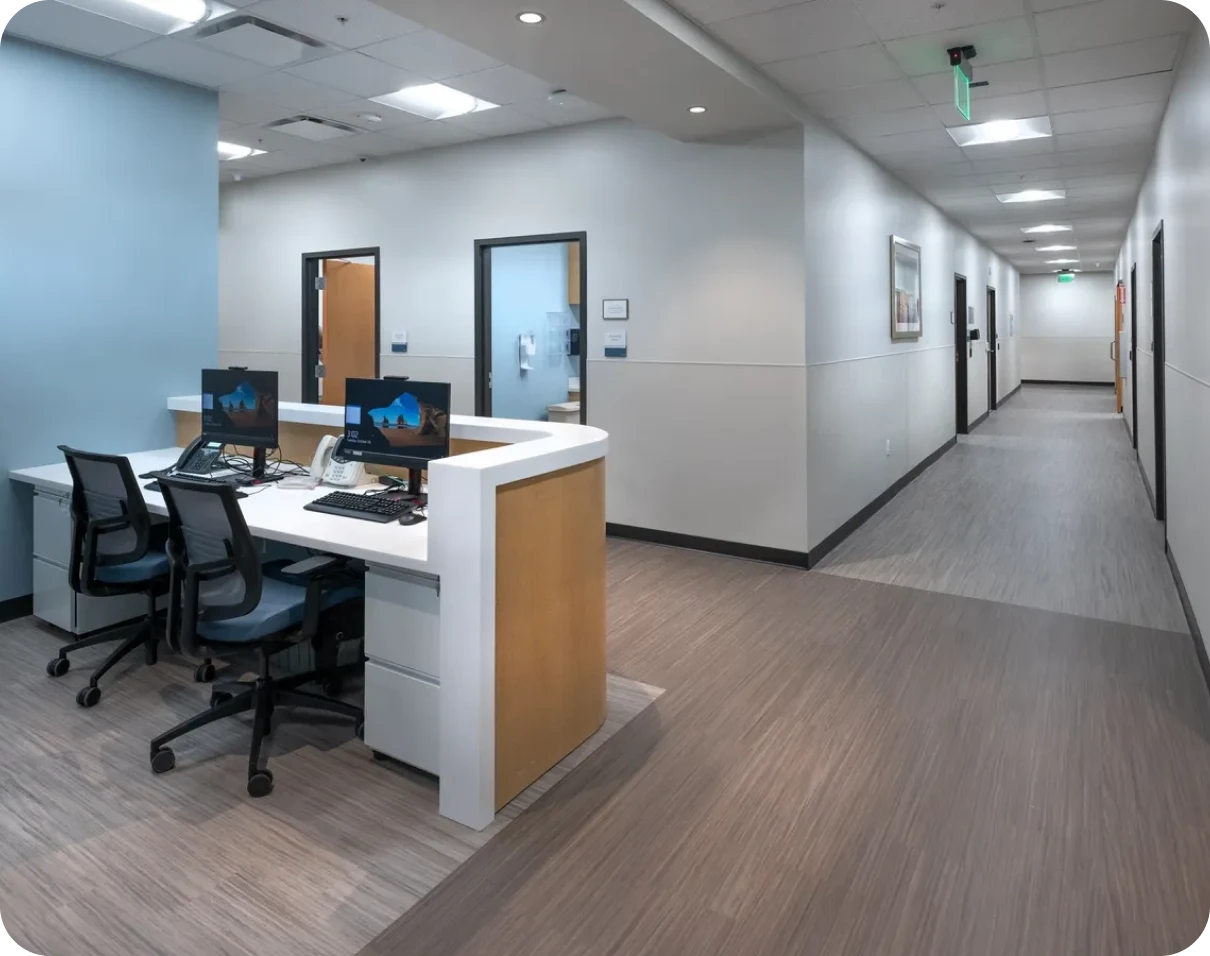 Empty office corridor with desks