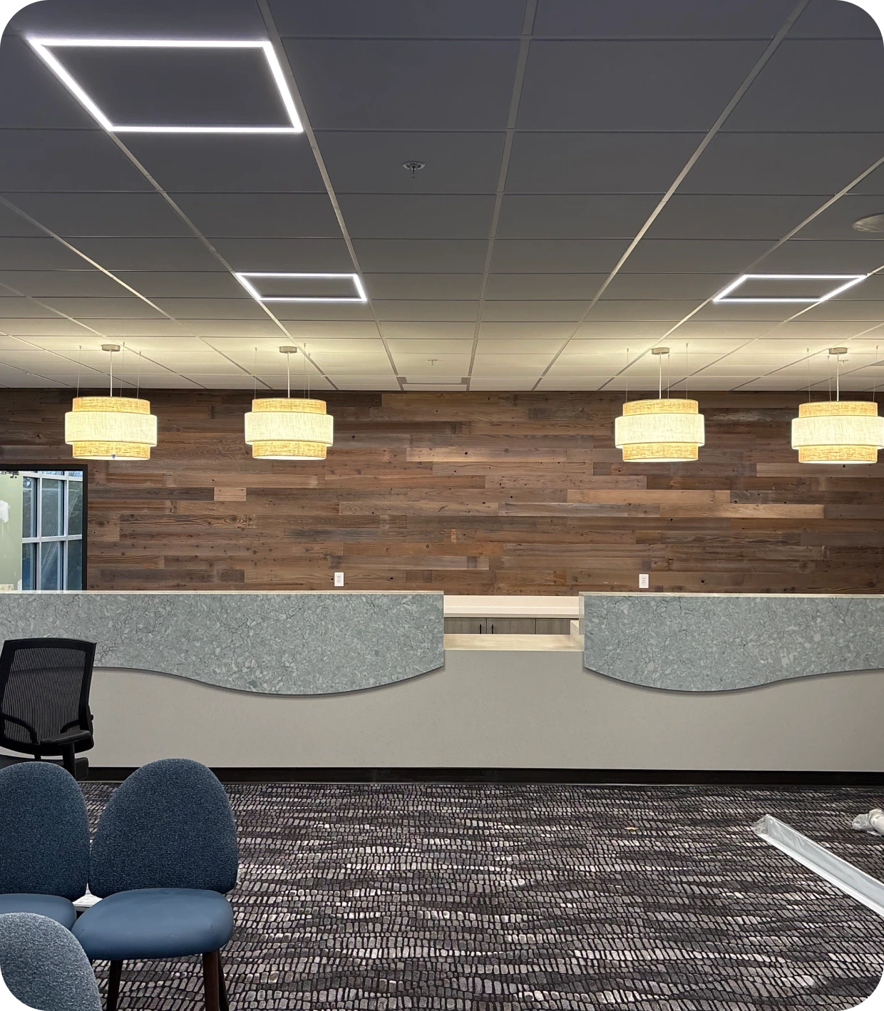 Modern reception area with hanging lights.