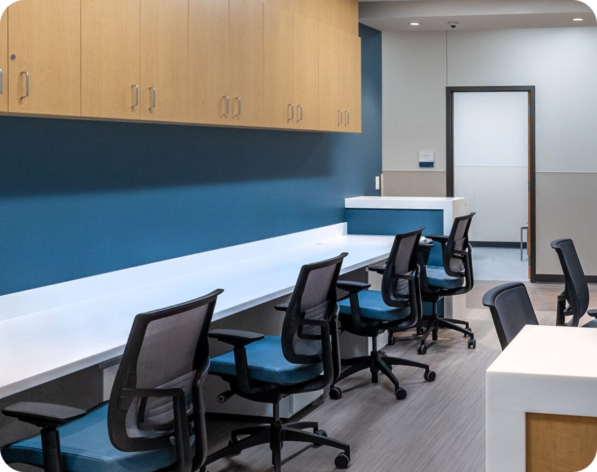 Empty modern office workspace with blue wall