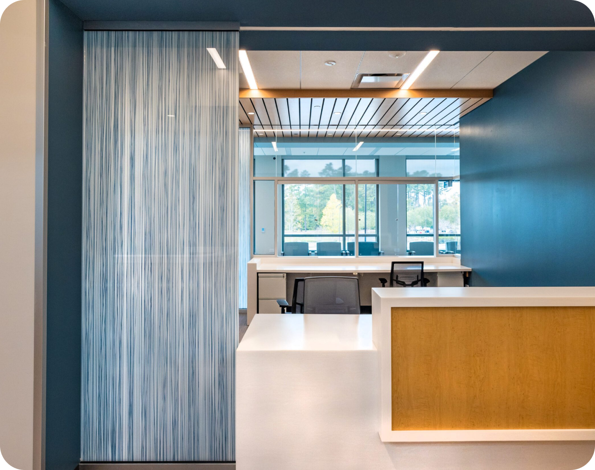 Modern office reception desk with blue walls