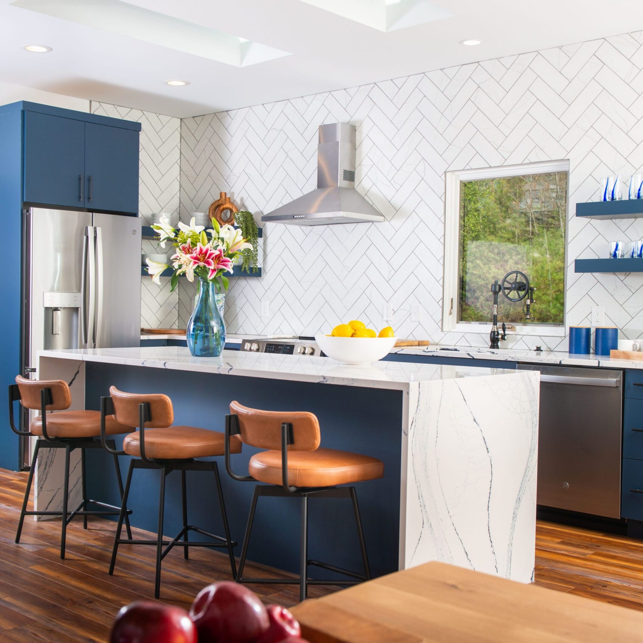 Modern blue kitchen island with leather stools